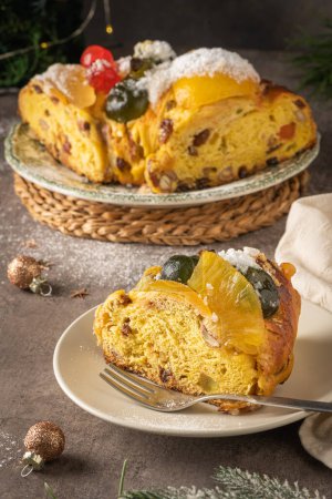 Bolo Rei or Kings Cake is a traditional Xmas cake with fruits raisins nut and icing on kitcthen countertop. Is made for Christmas, Carnavale or Mardi Gras