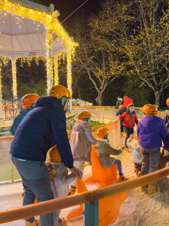 Photo for Oliveira de Azemeis, Portugal - december 2 2023: Families watching the Christmas lights and having fun with the children at the Christmas attractions in La Salette park during Christmas season - Royalty Free Image