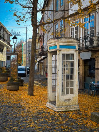 Autumn city landscape with typical white telephone booth in Chaves, Vila Real, Tras os Montes, Portugal.