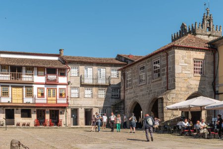 Photo for Guimaraes, Portugal - April 26, 2018. Largo da Oliveira, Olive tree square, is the main square of historical center of Guimaraes, Portugal. - Royalty Free Image