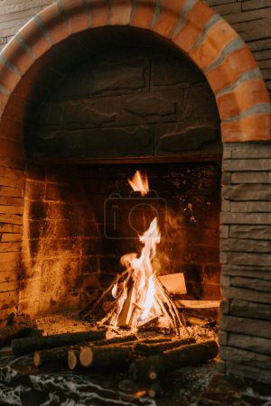 Photo for Fireplace burning wood logs, cozy warm home - Royalty Free Image