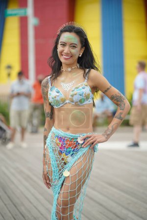 Photo for NEW YORK - JUNE 18, 2022: Participant posing during the 40th Annual Mermaid Parade at Coney Island, the largest parade in the nation and a celebration of ancient mythology on June 18, 2022 in Brooklyn NY. - Royalty Free Image