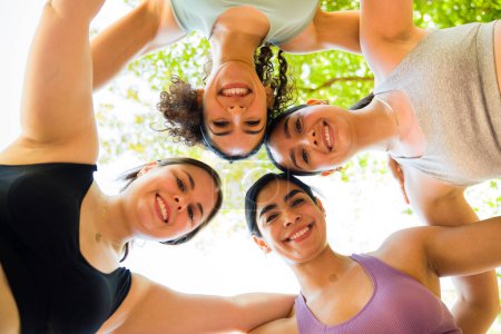Photo for Low angle of a happy beautiful woman with body diversity and acceptance smiling and ready to start their outdoor exercise together - Royalty Free Image