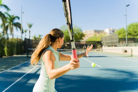 Photo for Mexican tennis player ready to start playing a tennis match and training for a match on the tennis court - Royalty Free Image