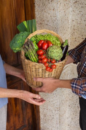 Photo for Organic bio local food delivery, zero waste, eco-friendly concept. Assortment of ripe vegetables from orchard in farmer hands - Royalty Free Image