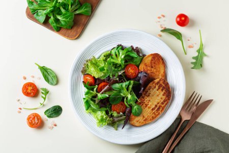 Photo for Plant based meat, vegan chicken fillet steak with salad. Food to reduce carbon footprint, sustainable consumption. Lunch concept - Royalty Free Image
