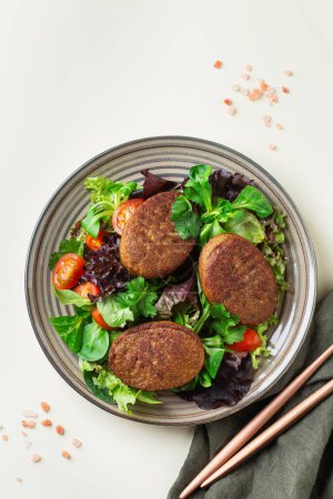 Photo for Plant based meat, vegan cutlet with salad. Food to reduce carbon footprint, sustainable consumption. Lunch concept - Royalty Free Image