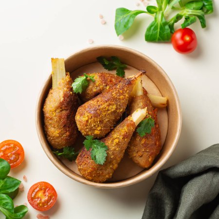 Photo for Plant based meat, healthy vegan chicken drumsticks. Food to reduce carbon footprint, sustainable consumption. Lunch concept - Royalty Free Image