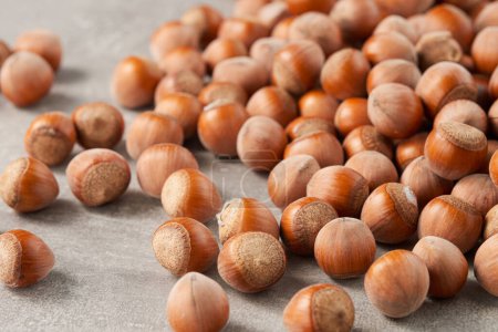 A large group of shelled hazelnuts on the table. Low angle view.