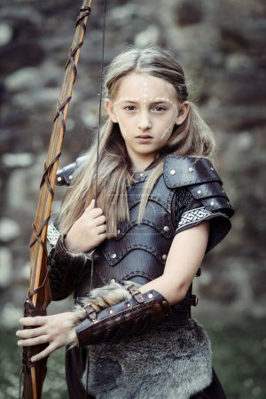 Photo for Girl in Medieval costume with bow - Royalty Free Image