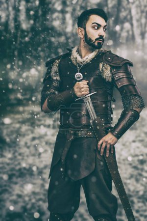 Man in medieval hand made leather costume with sword