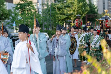 Photo for Osaka, Japan - July 25 2023 : Tenjin Matsuri Festival. People wearing traditional clothes walking through the streets. - Royalty Free Image