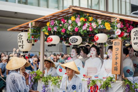 Photo for Kyoto, Japan - July 24 2023 : Gion Matsuri Festival, Hanagasa Junko Parade. Flower Umbrella Procession of float parade on the city street. - Royalty Free Image
