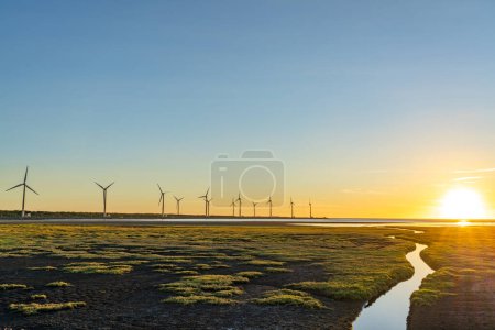 Gaomei Wetlands Area wind turbines in sunset time, a flat land which spans over 300 hectares, also a popular scenic spots in Qingshui District, Taichung City, Taiwan