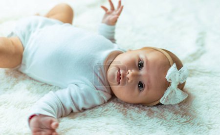 Photo for Baby sisters lie on a blanket. selective focus. kid. - Royalty Free Image