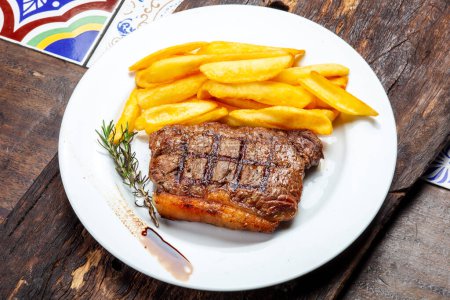 Photo for Chorizo steak, against fillet, fries - Royalty Free Image