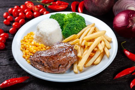 Photo for Grilled meat, french fries, rice, broccoli, corn - Royalty Free Image