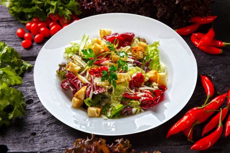 Photo for Salad with toast, dried tomatoes, lettuce and grated parmesan - Royalty Free Image