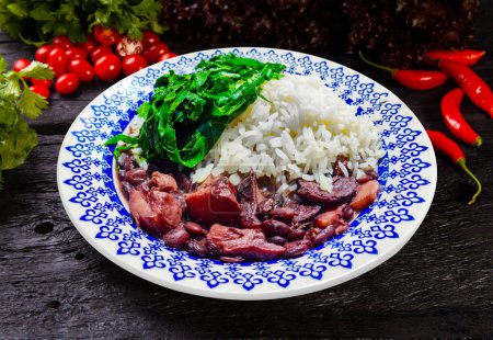 Photo for Traditional Brazilian feijoada with cabbage and rice - Royalty Free Image