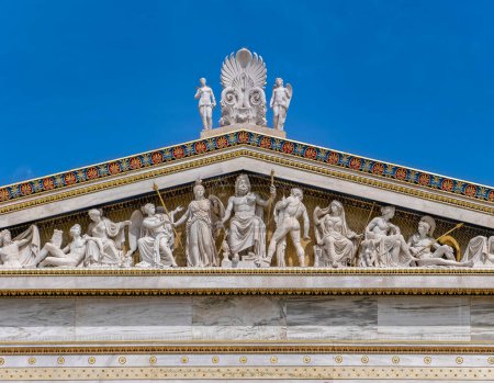 ancient Greek gods and deities statues in Neo classical pediment of the national academy of Athens Greece under clear blue sky, space for text