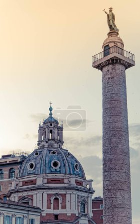 golden hour over Trajan's column and  St. Mary church dome, Rome Italy