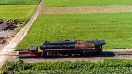 Photo for A Drone View of An Antique Steam Locomotive Being Repaired, With its Outer Shell Removed on a Sunny Summer Day - Royalty Free Image