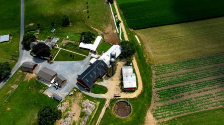 An Aerial View of Rural Farm Buildings and Fields