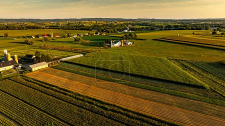 An Aerial View of Rural Farmland and Community at Sunset