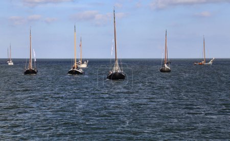 Photo for Volendam, The Netherlands - September 12, 2019: Historical sailboats participate in a regatta on the IJselmeer lake near Volendam, The Netherlands on September 12, 2019 - Royalty Free Image