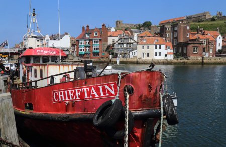 Photo for Whitby, United Kingdom - June 23, 2022: Rusted boat in the harbour of Whitby, UK on June 23, 2025. - Royalty Free Image