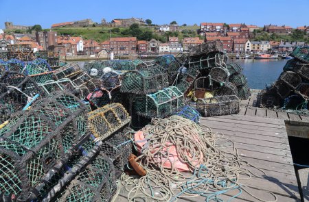 Photo for Whitby, United Kingdom - June 23, 2022: Fishing nets in the harbour of Whitby, UK on June 23, 2025. - Royalty Free Image