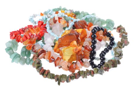 A pile of string of Handmade jewelry  ,pink quartz,Carnelian stone ,Unakite stone ,green aventurine,amber, black tourmaline.