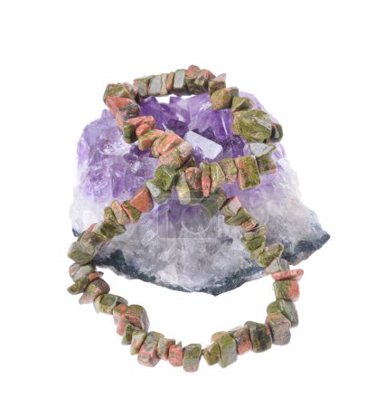 Unakit stone  braceleton on isolated white background . Bracelet made of stones on hand from natural Carnelian. Handmade jewelry bracelets .