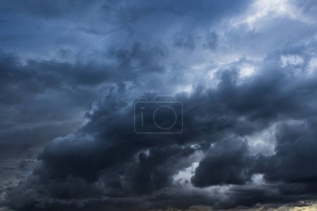 Photo for Ominous black storm clouds create an ethereal textured background element. - Royalty Free Image