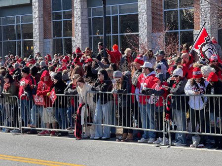 Photo for Athens, GA / USA - January 14, 2023:  UGA football fans line up against a barricade on Lumpkin Street for the football team's national championship victory parade on January 14, 2023 in Athens, GA. - Royalty Free Image