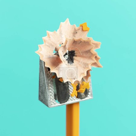 Photo for Pencil and manual sharpener with long shavings. - Royalty Free Image