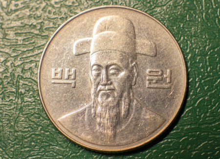Photo for Reverse of the coin 100 Korean won on a dark background. - Royalty Free Image