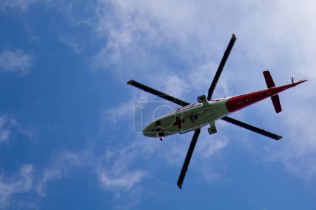 Photo for Helicopter ambulance in the sky close-up - Royalty Free Image