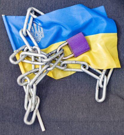 Chain lock on Ukraine flag. Ban on citizens leaving the country
