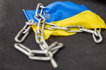 Chain on the flag of Ukraine. Ban on citizens leaving the country