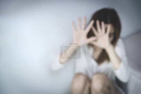 Photo for Blurred photo Women use cloth to hide their bodies in fear.  Stop sexual harassment and rape. International Women's Day. - Royalty Free Image