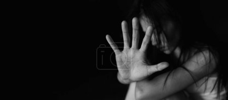 Photo for Young depressed woman, domestic violence and rape. stop abusing violence,  human trafficking, stop violence against women, Human is not a product. Stop women abuse, Human rights violations. - Royalty Free Image