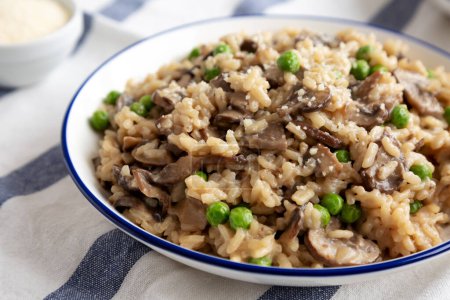 Homemade Mushroom Risotto with Peas on a Plate, side view.