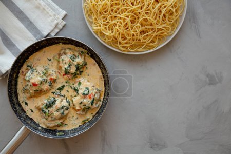 Photo for Homemade Creamy Tuscan Chicken with Spinach, top view. From above, overhead, flat lay. Copy space. - Royalty Free Image