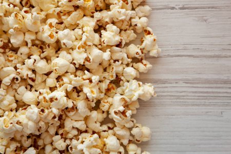 Photo for Homemade Buttered Popcorn with Salt, top view. Flat lay, overhead, from above. Copy space. - Royalty Free Image