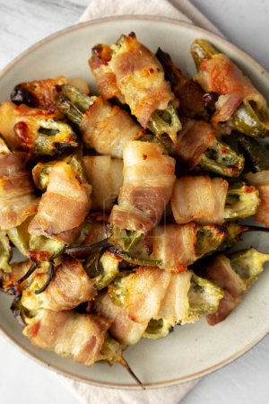 Photo for Homemade Bacon-Wrapped Jalapeno Poppers on a Plate, top view. Close-up. - Royalty Free Image