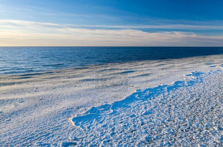 Scenic landscape of shore of Baltic sea at winter. Snow and ice. Seascape.