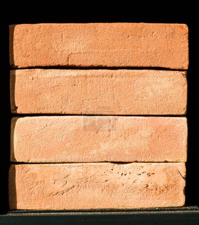 Photo for Close-up of a stack of four bricks. Material for construction. - Royalty Free Image