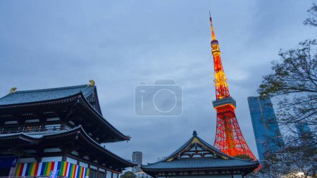 Photo for TOKYO, JAPAN  APRIL 2024 Spectacular perspective view of Tokyo Tower illuminated at night. The Tokyo Tower is a telecommunications building and also a panoramic observatory located in Minato district, Tokyo, Japan. - Royalty Free Image