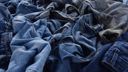 Photo for The Blue Jeans, Old denim clothing. Recycle Textile Waste. Fashion industry textile waste problem. High quality photo - Royalty Free Image